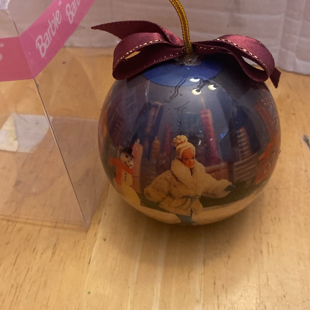 Barbie ornament. Round but flat on bottom so can stand on its own. Plastic